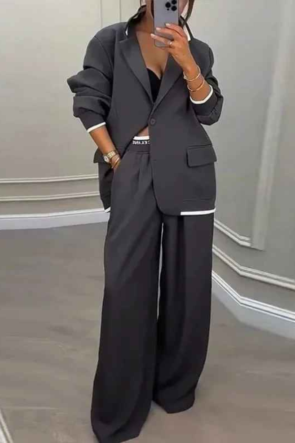 Set audace con blazer sportivo e pantaloni larghi con tasche