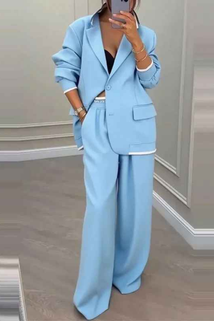 Set audace con blazer sportivo e pantaloni larghi con tasche